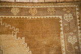 Evenly worn pile on a Kars carpet, detailing the stepped spandrel and floral border.