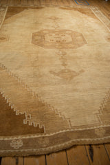 Angled perspective of a vintage Kars carpet's octagonal medallion and stepped corner spandrels.