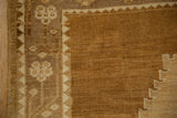 Textured pile of a vintage Kars carpet's stepped spandrel and floral border.