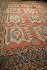 Detailed surface view of an antique Bakshaish carpet showing its even wear across the knot heads.