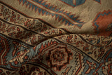 Coarse hand-knotted pile showing serrated leaf and palmette motifs in blue and red.