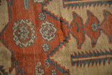 Detail showing an expert restoration alongside the even wear to knot heads on an antique carpet.