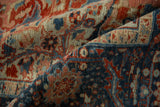 Detailed view of the time-softened pile and weave on a distressed vintage Ahar carpet.