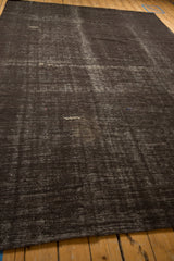 A low perspective across the vintage Turkish Kilim showing its textured, abrash surface.
