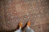 Distressed vintage Persian Tabriz carpet with faded slate blue, cherry red, ivory Herati pattern.