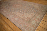 Worn slate blue Herati pattern and red vine border on a vintage Tabriz rug.