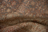 Decorative distressed texture of vintage Tabriz carpet pile showing faded slate blue and cherry red Herati.