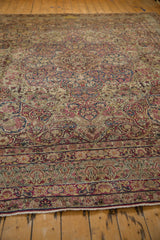 The intricate border pattern and secured end of a hand-knotted antique Kerman carpet.