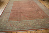 Intricate patterns on distressed vintage Mir Sarouk border with brick red, ivory, powder blue.