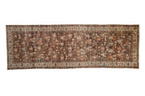 Vintage distressed Malayer rug runner with allover botanicals in dusty rose and burgundy over a charcoal field.