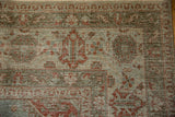 Detail of the distressed, low-pile texture and border on a vintage Veece carpet corner.