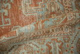 A soft fold on the distressed Veece carpet reveals its storied texture and low pile.