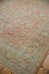 Decorative low-pile texture on a vintage Sarouk with faded ruby and powder blue floral details.