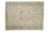 Vintage distressed Heriz carpet with a large-scale allover pattern in soft ivory, sand, and dusty blue tones.