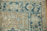 Corner detail of a vintage Heriz showing the Turtle Samovar border and low-pile, hand-knotted texture.