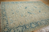 Geometric Turtle Samovar border design on a time-softened vintage Persian Heriz rug.
