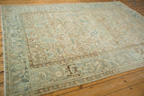 Distressed geometric floral field and Turtle Samovar border on vintage Mehrivan rug.