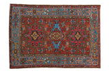Vintage Karaja rug, brick red, sky blue, triple medallions, geometric floral motifs.