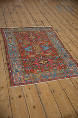 Intact side selvage and sky blue Samovar main border of a vintage Persian Karaja rug.