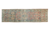 Distressed vintage Sarouk runner with faded ruby red and dusty teal floral motifs, 2'5