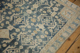 Distressed Hamadan rug with even wear, featuring dusty navy, ivory, and floral patterns.