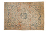 Vintage Distressed Meshed carpet with oversized medallion, faded beige, blue, and terracotta.