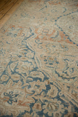 Textured detail of distressed vintage Meshed rug, showing faded blues, terracotta, and foundation wear.
