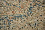 Vintage Distressed Meshed carpet detail: worn pile, beige abrash, faded blue palmettes.
