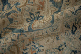 Vintage distressed Meshed carpet displaying worn texture, faded blue palmettes, and abrash throughout.
