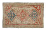 Distressed vintage Shiraz rug with a triple medallion in sky blue, ruby red, and cream tones.