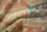 The low, even pile of a distressed Shiraz rug showing its pliable, hand-knotted texture.