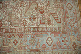 Repeating Samovar Turtle motif on the powder blue border of a vintage Persian Heriz rug.