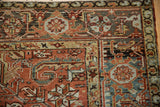 Corner detail of a vintage Heriz carpet showing the Turtle Samovar border against the madder red field.