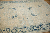 A vintage Mehrivan carpet showing even wear across its ivory field and blue geometric border.