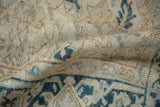 A wave in the vintage Mehrivan carpet reveals its hand-knotted texture and evenly worn pile.