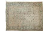 Vintage distressed Heriz carpet, faded ivory field with pale blue geometric pattern.