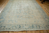 Distressed vintage Heriz rug, secured side, and pale blue Turtle Samovar border.