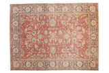 Distressed vintage Sparta carpet with raspberry red field, navy blue medallion, ivory palmettes and vines.