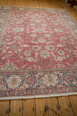 Distressed vintage Sparta carpet border featuring palmette, serrated leaf motif, and fringe.