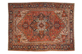 Vintage Heriz hand-knotted carpet with quatrefoil medallion, brick red field, navy Turtle Samovar border.