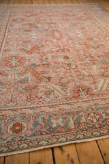 Angled view of a vintage Heriz carpet, highlighting the Herati and Turtle Samovar border in the foreground.