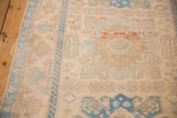 Even wear across the knot heads showing dusty sky blue and ivory geometric motifs.