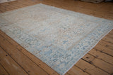 Muted blue, beige distressed Mehrivan carpet with geometric floral field and ornate Turtle Samovar border.