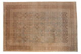 Distressed antique Persian Tabriz carpet, allover botanical lattice in muted blue-green and warm earth tones.