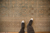Detail of antique Tabriz carpet showing distressed pile, dusty ocean blue-green and sandalwood vines.