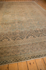 Antique Tabriz carpet with distressed details, floral guls, and lattice panels in seafoam green, sandalwood.