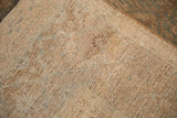 Distressed antique Tabriz carpet foundation with beige threads and localized restoration.