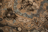 Detail of the distressed pile showing blue cloudband contours and blossom designs on the vintage Khoy carpet.