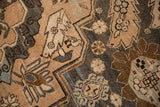 Close-up of the vintage rug's geometric cartouche border with Samovar and blossom design elements.