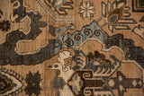 Detailed weave of a distressed Khoy carpet with charcoal cloudband and silver blossom motifs.